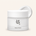 Beauty of Joseon Dynasty Cream in a frosted white jar with an open lid on a clean ivory background.